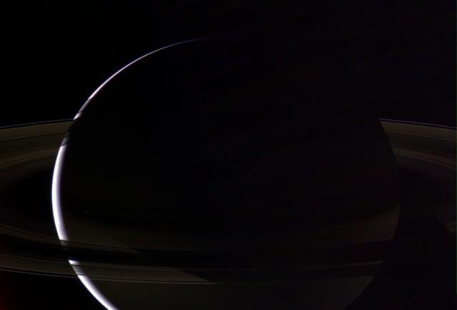 With its dazzling rings, Saturn radiates a beauty and splendor like no other known world. Here, Cassini has captured the cool crescent of Saturn from above the ringplane, with the planet shadow cutting neatly across the many lanes of ice