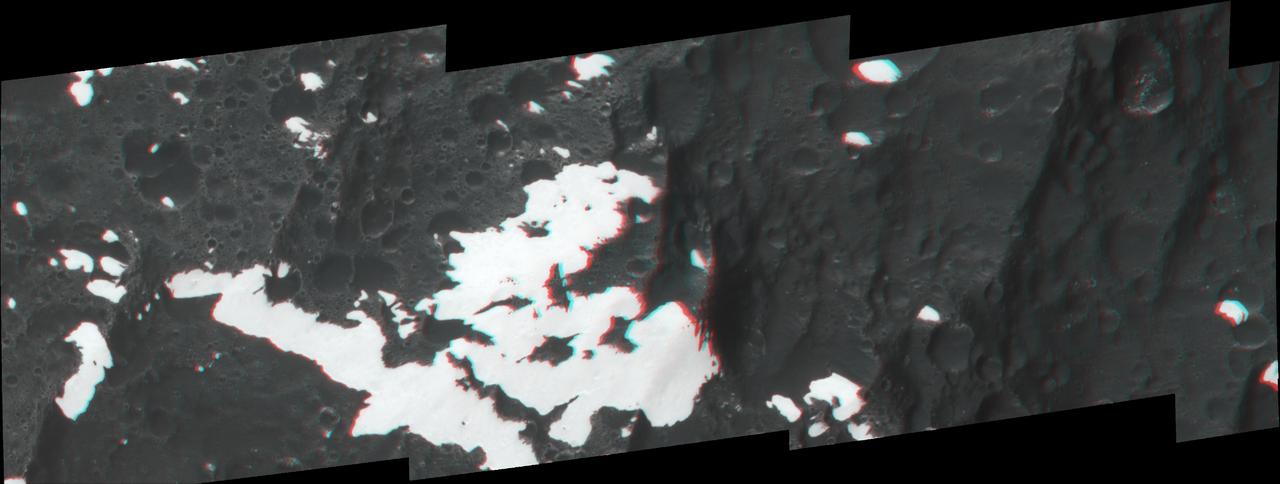 This anaglyph, shows huge mountains on Saturn moon Iapetus, imaged by NASA Cassini spacecraft during its very close flyby in Sept. 2007. 3D glasses are necessary to view this image.