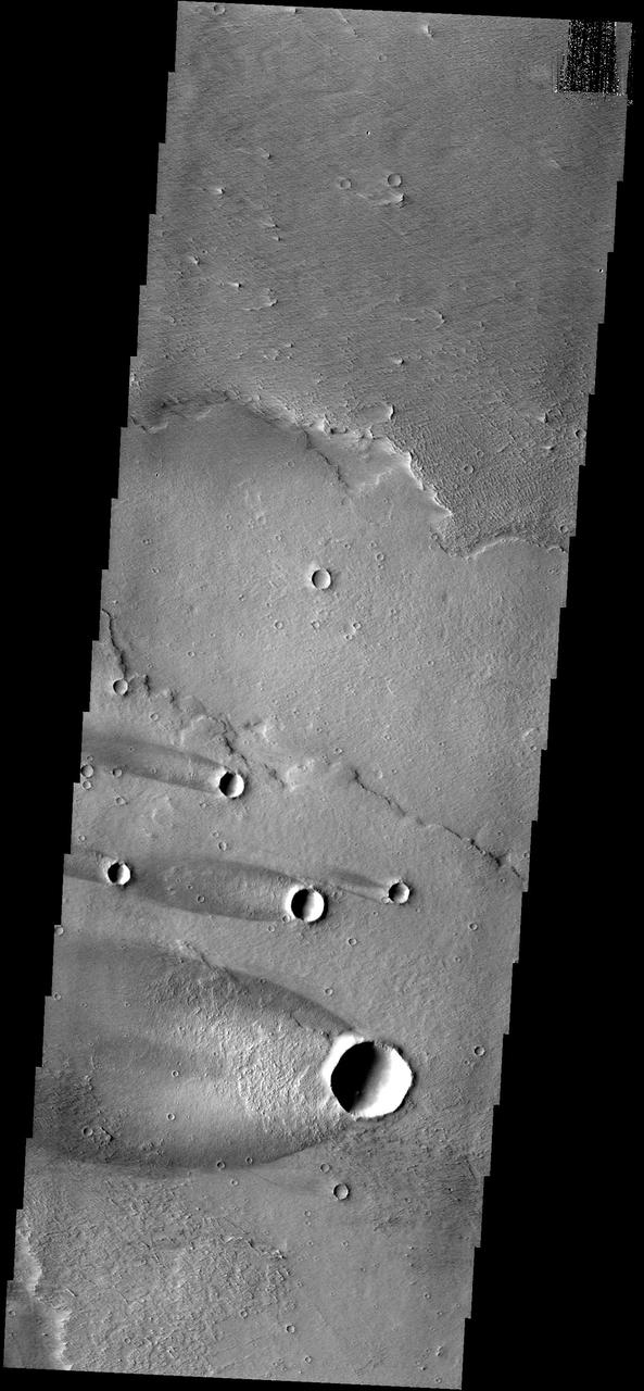 This group of windstreaks is located on lava flows west of Arsia Mons