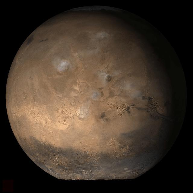 This picture is a composite of MOC daily global images acquired at Ls 53° during a previous Mars year. This month, Mars looks similar, as Ls 53° occurs in mid-May 2006. The picture shows the Tharsis face of Mars