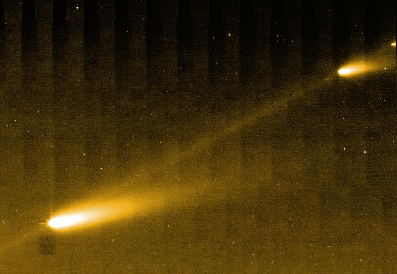 NASA Spitzer Space Telescope shows three of the many fragments making up Comet 73P/Schwassman-Wachmann 3. The picture also provides the best look yet at the crumbling comet trail of debris.