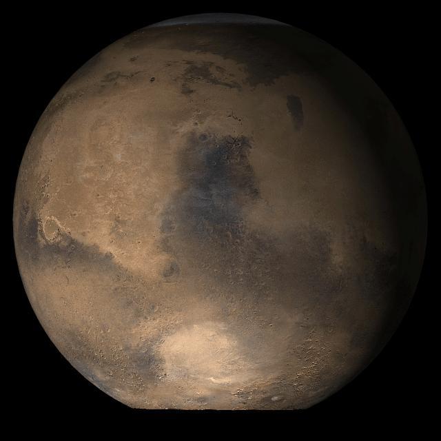This picture is a composite of Mars MOC daily global images acquired at Ls 53° during a previous Mars year. This month, Mars looks similar, as Ls 53° occurs in mid-May 2006. The picture shows the Syrtis Major face of Mars