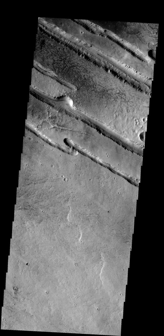 These linear fractures are part of Panchaia Rupes