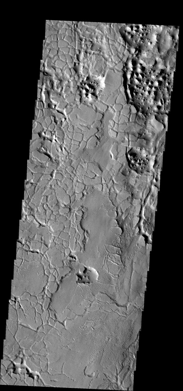 The materials in this region are cracked into individual pieces that with time weather into chaos terrain. This image is located on the southernmost border of Elysium Planitia