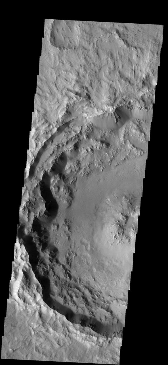 The rim and floor of this southern crater are relatively unmodified, indicating that this crater is younger than its more weathered neighbors