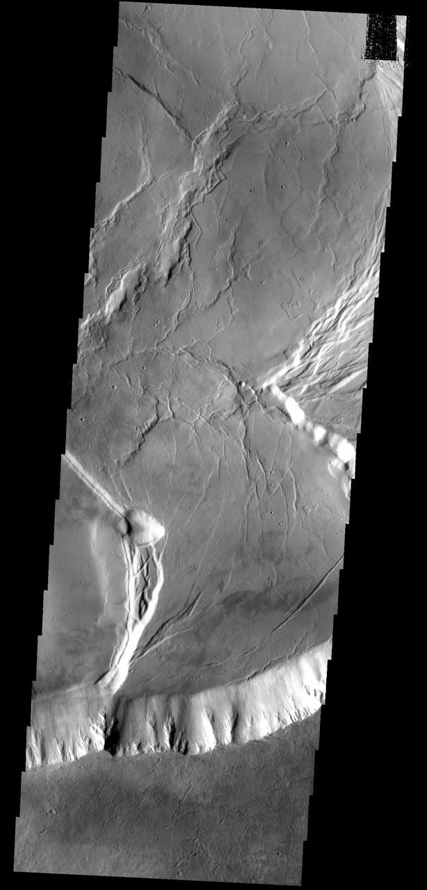 This image shows a portion of the summit caldera of Olympus Mons