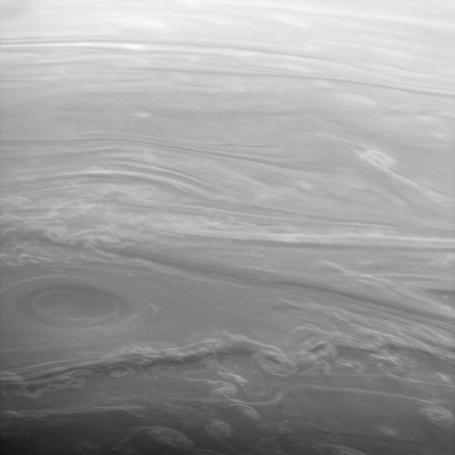 This spectacular image of Saturn clouds looks obliquely across the high northern latitudes. The Sun is low on the horizon here, making the vertical extent of the clouds easier to see. Cloud bands surrounding the vortex