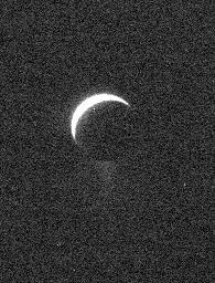A ghostly view of Enceladus reveals the specter of the moon icy plume of fine particles. Scientists continue to monitor the plume, where mission planning allows, using the Cassini spacecraft imaging cameras