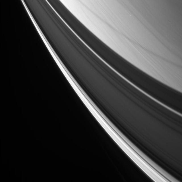 Streaks of cloud are overlain with graceful ring shadows in this view of Saturn northern latitudes