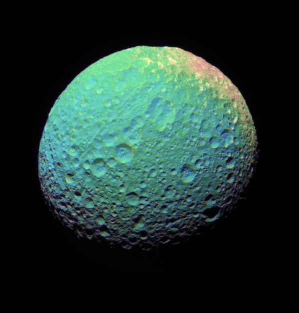 This extreme false-color view of Mimas shows color variation across the moon surface