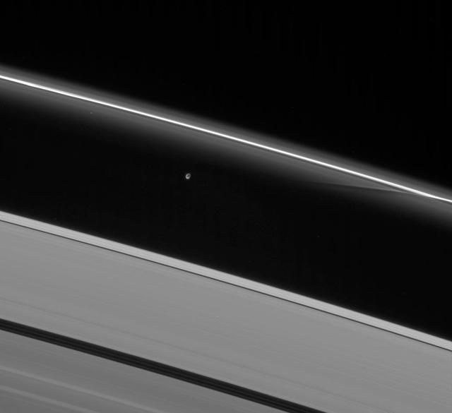 Prometheus interacts gravitationally with the inner flanking ringlets of the F ring, creating dark channels as it passes
