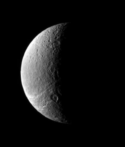 This view looks toward Rhea north polar region, where icy fractures slither away toward the south