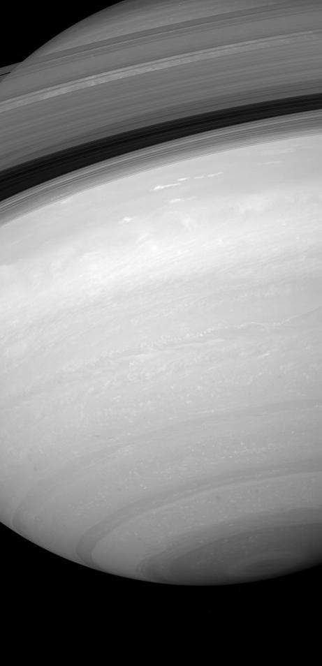 From beneath the ringplane, the Cassini spacecraft takes stock of Saturn southern skies and peeks through the rings and beyond their shadows at the northern latitudes