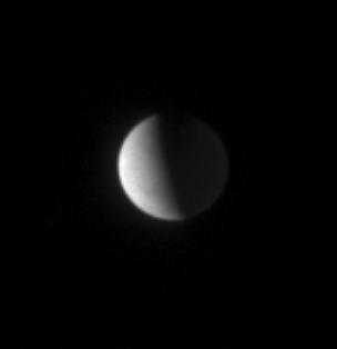 The high northern latitudes on Enceladus show little detail from Cassini distant vantage point, nearly 50 degrees above the moon equator