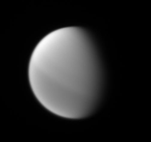 This Cassini spacecraft view shows the interesting north-south asymmetry in Titan atmosphere, which is thought to be a seasonal effect