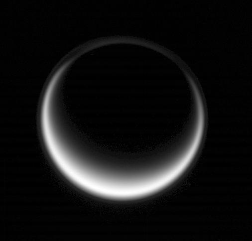 Sunlight scatters through Titan atmosphere, illuminating high hazes and bathing the entire moon in a soft glow