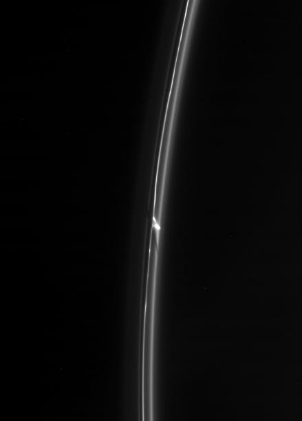 The Cassini spacecraft spies an intriguing bright clump in Saturn F ring. Also of interest is the dark gash that appears to cut through the ring immediately below the clump