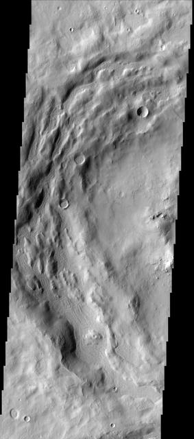 The depressions in the rim of this unnamed crater in Terra Sabaea are being filled with new material. The surface texture of the new material is different from the surrounding older material