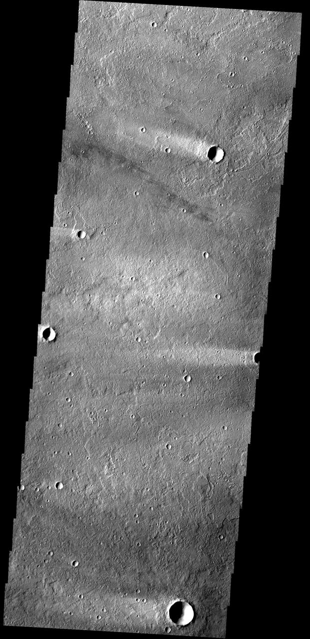 The windstreaks in this image are located on Tharsis volcanic flows northeast of Olympus Mons
