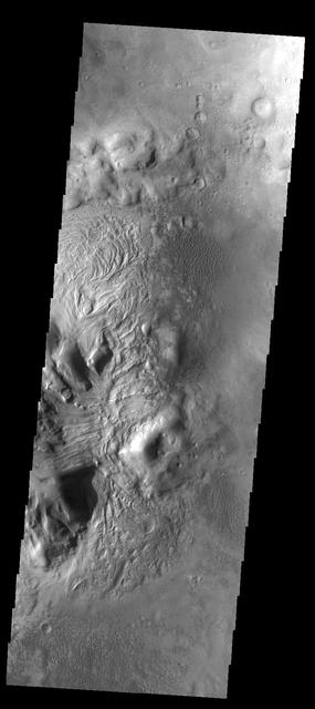 This unnamed northern crater contains several dune fields. Within the central peak region (left side of image) there is material with a "swirled" surface pattern/texture. This type of texture indicates that volitiles may exist within the material.  Image information: VIS instrument. Latitude 41.8N, Longitude 44.8E. 38 meter/pixel resolution.  http://photojournal.jpl.nasa.gov/catalog/PIA09124