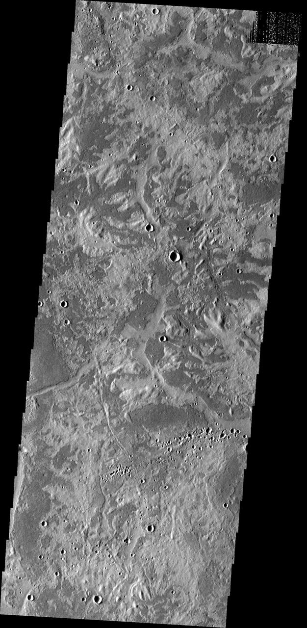 East of Adamas Labyrinthus is this region with a stark contrast between bright and dark surfaces