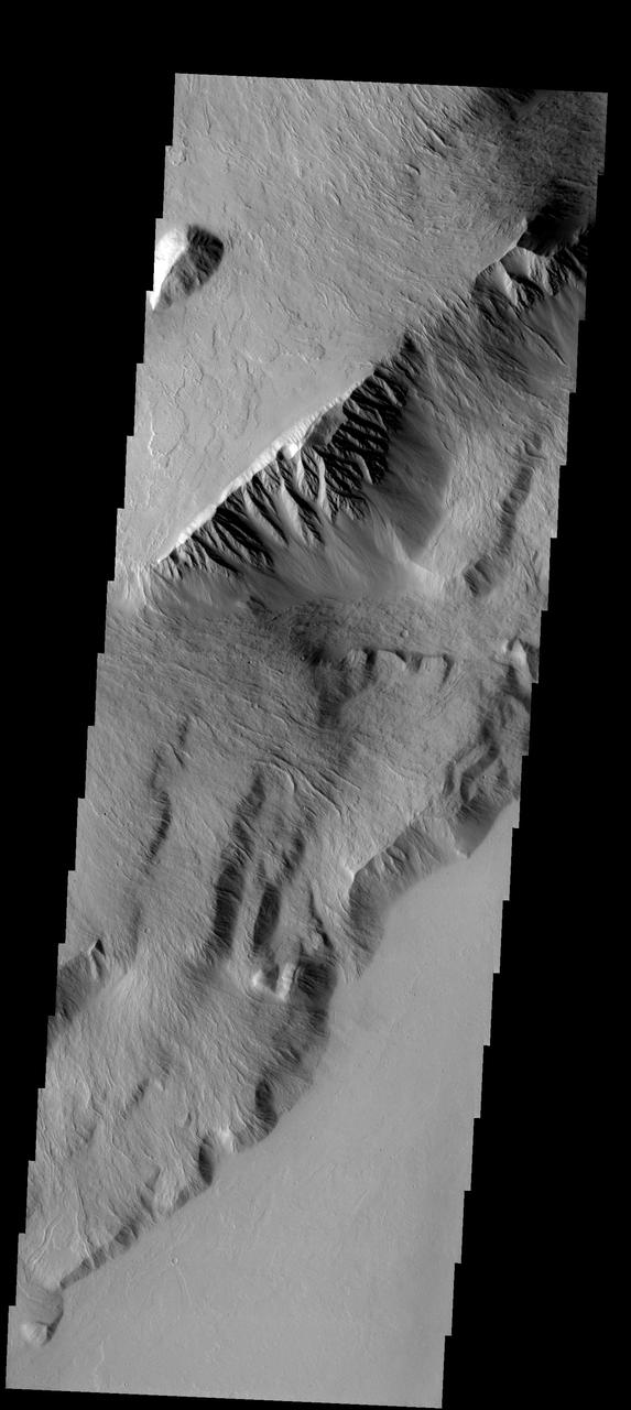This spectacular image shows part of the escarpment of the Olympus Mons volcano