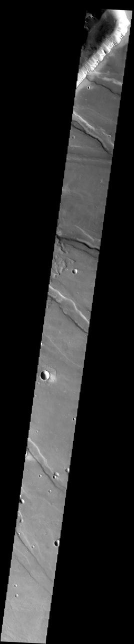 The slope streaks and small, dark landslides are located in Noctus Labyrinthus