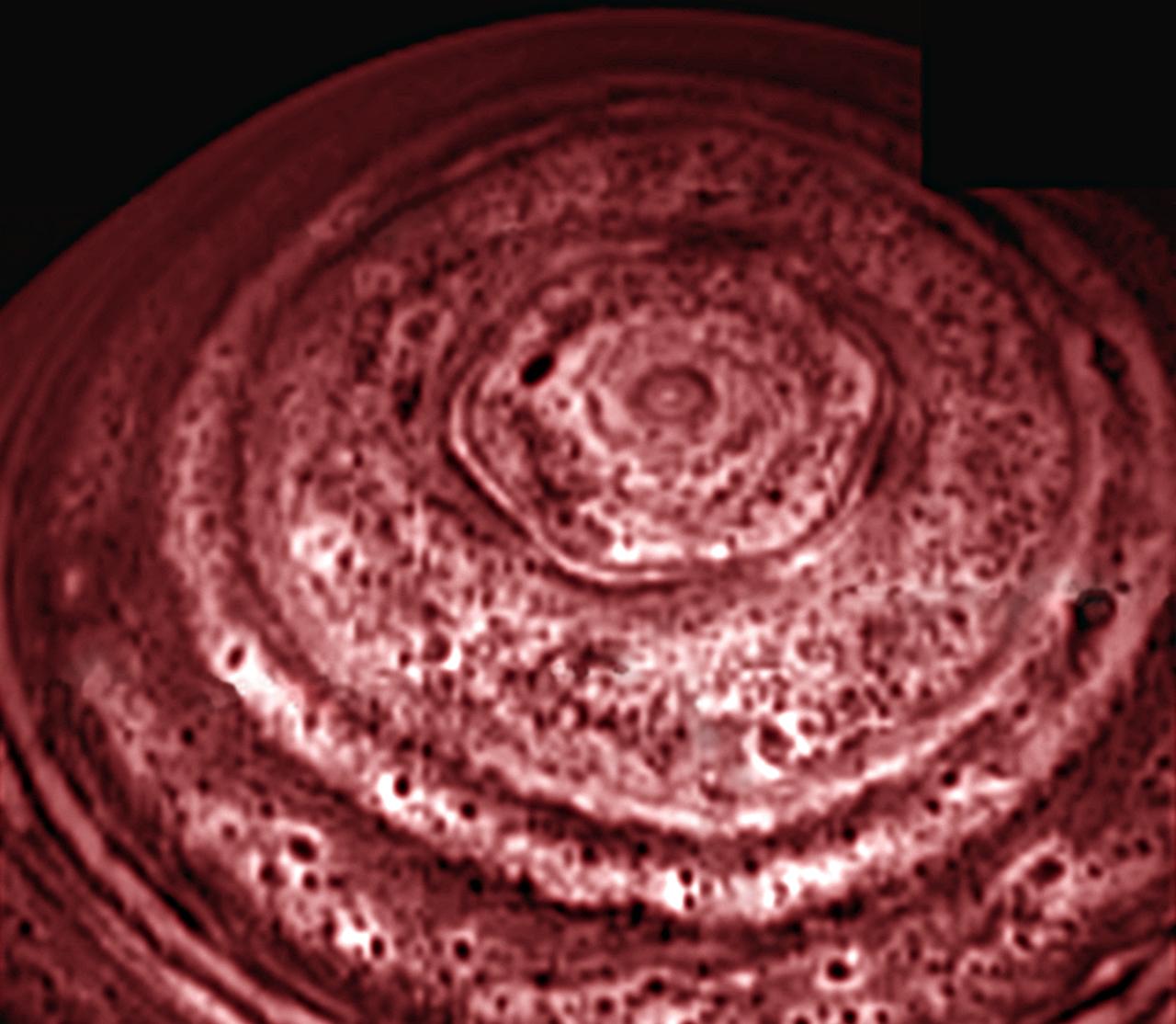 A bizarre six-sided feature encircling the north pole of Saturn has been spied by the VIMS on NASA Cassini spacecraft. This image is one of the first clear images ever taken of the north polar region as seen from a unique polar perspective