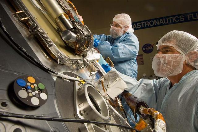 Lockheed Martin Space Systems technicians work on the science deck of NASA Phoenix Mars Lander