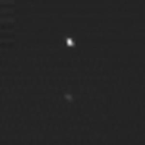 The two pots in this image are a composite of two images of asteroid 2002 JF56 taken on June 11 and June 12, 2006, with the Multispectral Visible Imaging Camera component of the New Horizons Ralph imager.