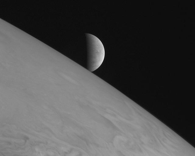 New Horizons took this image of the icy moon Europa rising above Jupiter cloud tops with its Long Range Reconnaissance Imager LORRI at 11:48 Universal Time on February 28, 2007, six hours after the spacecraft closest approach to Jupiter.