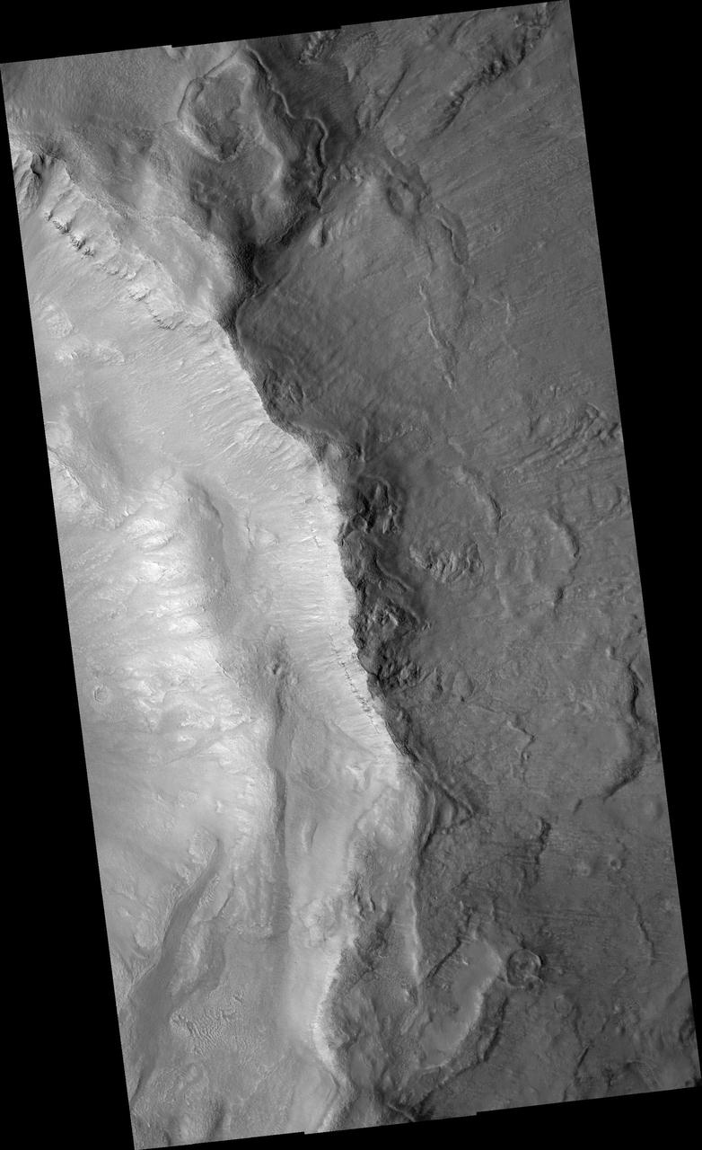 Gullies in Inner Slope of Crater and Exposed Bedrock