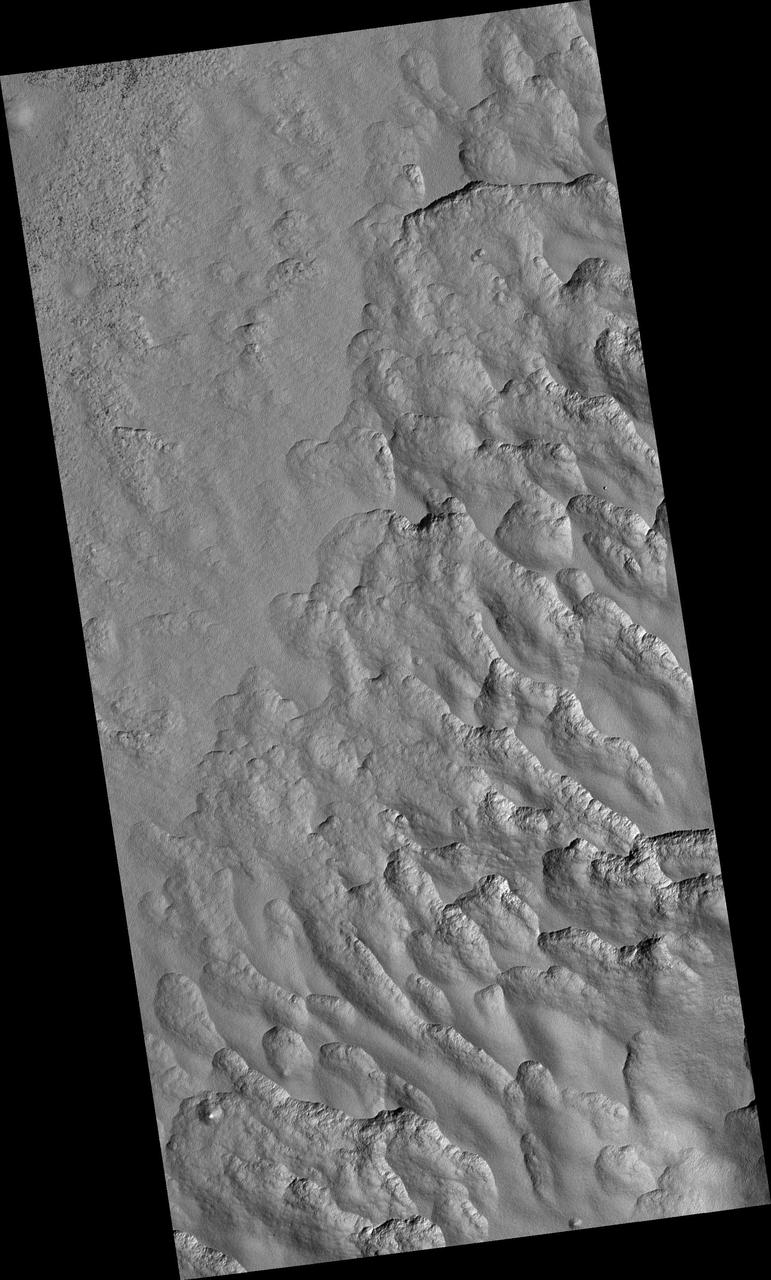 Scalloped Topography in Peneus Patera Crater