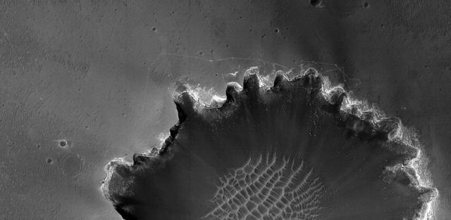 NASA image: Rover Tracks at Crater Edge