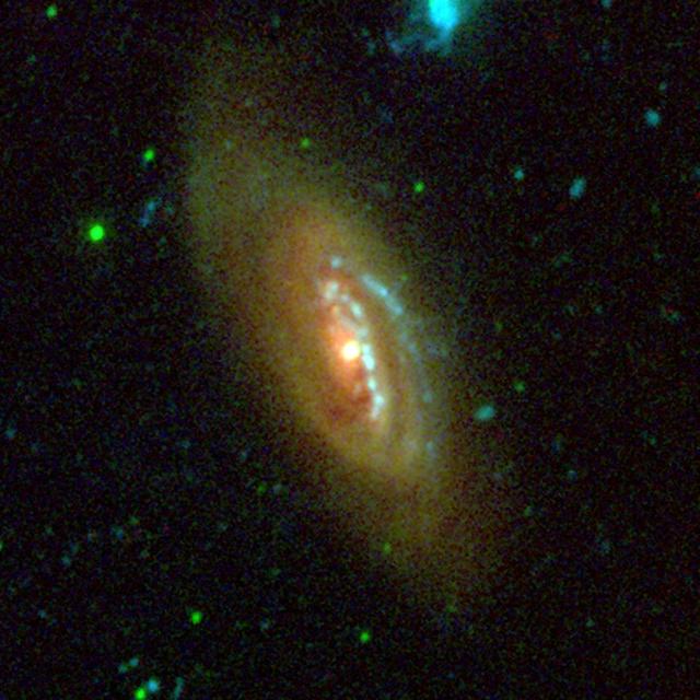 This image from NASA Galaxy Evolution Explorer shows the galaxy NGC 4569 in the constellation Virgo. It is one of the largest and brightest spiral galaxies found in the Virgo cluster of galaxies, the nearest major galaxy cluster to our Milky Way galaxy.