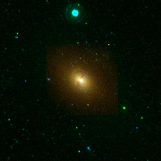 This image from NASA Galaxy Evolution Explorer shows the galaxy NGC 1316, located about 62 million light-years away in the constellation Fornax. The elliptical-shaped galaxy may be in the late stages of merging with a smaller companion galaxy.