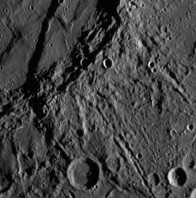Just 21 minutes after NASA MESSENGER spacecraft closest approach to Mercury, the Narrow Angle Camera NAC took this picture showing a variety of intriguing surface features, including craters as small as about 400 meters about 400 yards across.