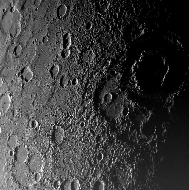 As NASA MESSENGER approached Mercury on January 14, 2008, the spacecraft Narrow-Angle Camera on the Mercury Dual Imaging System MDIS instrument captured this view of the planet rugged, cratered landscape illuminated obliquely by the Sun.
