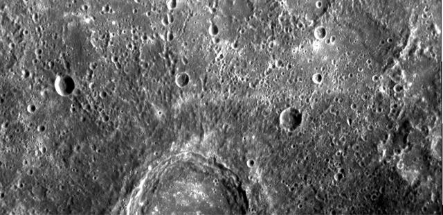 The image shows part of a large, fresh crater with secondary crater chains located near Mercury equator on the side of the planet newly imaged on January 14, 2008 by NASA MESSENGER spacecraft.