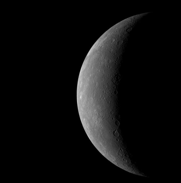 As NASA MESSENGER neared Mercury on January 14, 2008, the spacecraft Wide Angle Camera on the Mercury Dual Imaging System MDIS took this image of the planet full crescent.