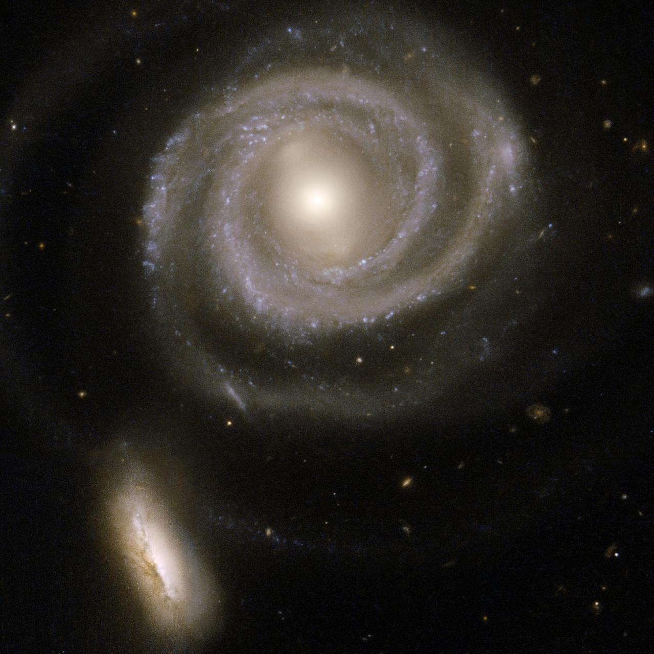 This beautiful pair of interacting galaxies consists of NGC 5754, the large spiral on the right, and NGC 5752, the smaller companion in the bottom left corner of the image. This image is from NASA Hubble Space Telescope.