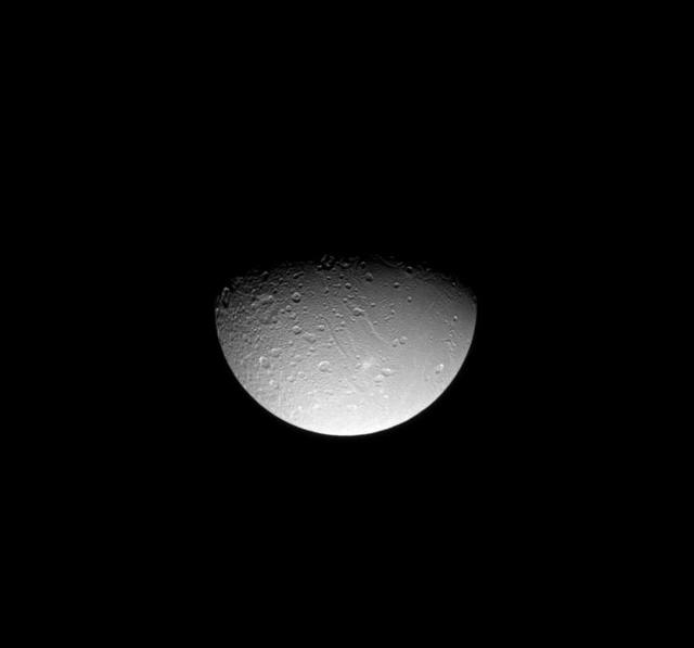 NASA image: Dione Fractured North