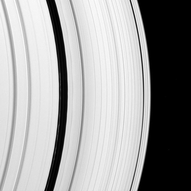 The Encke Gap moon, Pan, has left its mark on a scalloped ringlet of the Encke Gap. The moon creates these perturbations as it sweeps through the 325-kilometer 200-mile gap in the A ring