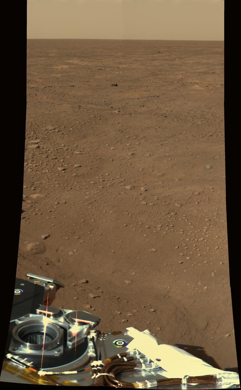 This approximate color view was obtained on sol 2 by the Surface Stereo Imager SSI on board NASA Mars Phoenix lander. The view is toward the northwest, showing polygonal terrain near the lander and out to the horizon.