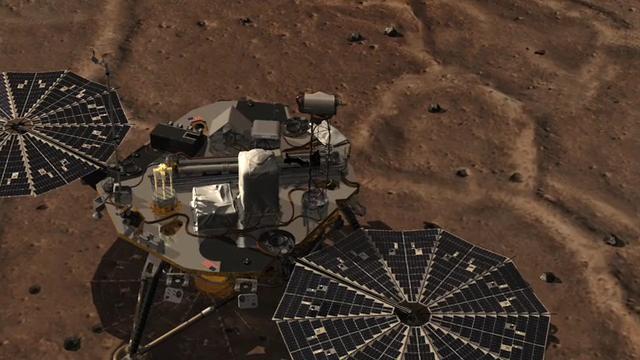 This image of a camera going through the Surface Stereo Imager SSI on NASA Phoenix lander. At the end of the animation is an approximate color mosaic taken by Phoenix SSI camera.