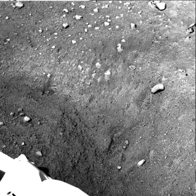 This from NASA Phoenix Mars Lander Stereo Surface Imager SSI camera shows Phoenix parachute, backshell, heatshield, and impact site.