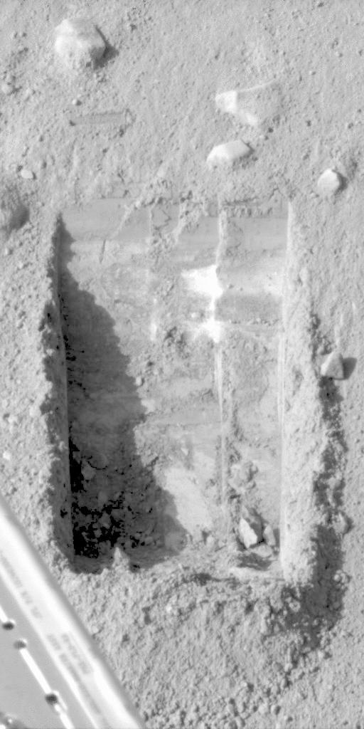 This image was acquired by NASA Phoenix Mars Lander Surface Stereo Imager and shows sublimation of ice in the trench informally called Dodo-Goldilocks over the course of four days.