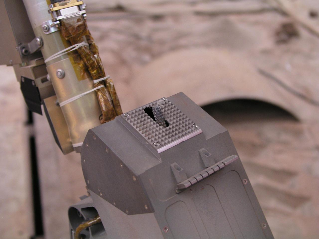 This close-up photograph taken at the Payload Interoperability Testbed at the University of Arizona, Tucson, shows the motorized rasp protruding from the bottom of the scoop on the engineering model of NASA Phoenix Mars Lander Robotic Arm.