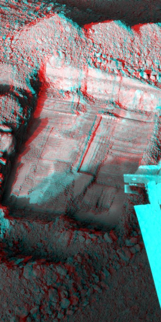 This anaglyph, acquired by NASA Phoenix Lander shows a stereoscopic 3D view of a trench informally called Snow White dug by Phoenix Robotic Arm. 3D glasses are necessary to view this image.