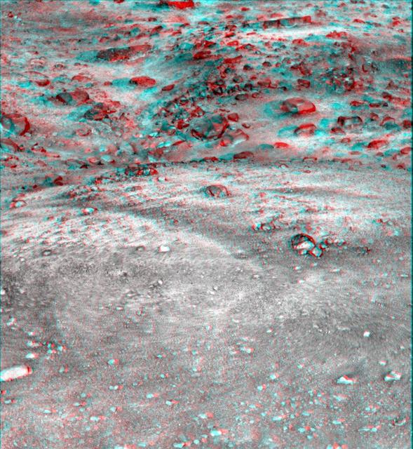 This anaglyph, acquired by NASA Phoenix Lander on Jun. 7, 2008, shows a stereoscopic 3D view of the Martian surface near the lander. 3D glasses are necessary to view this image.
